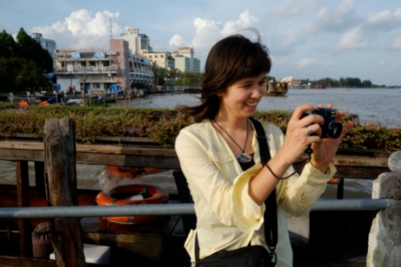 Photographing a Mekong boat scene. Photo by Bao Quan Nguyen.