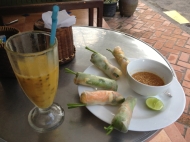 Passionfruit mango drink with veggie spring rolls. Delicious!